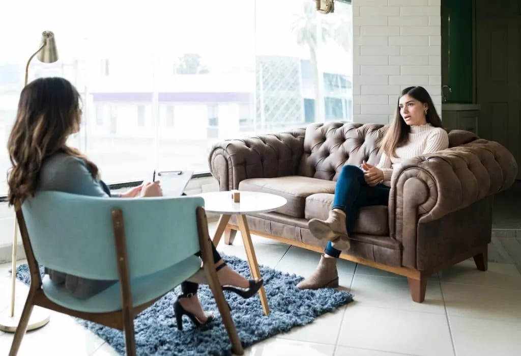 Woman Discussing With Therapist During Session